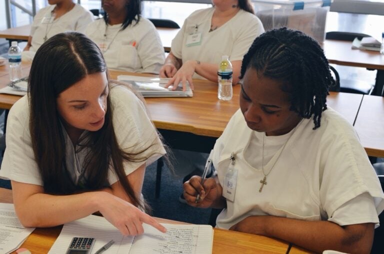 Two EWOP participants working through coursework together in the classroom