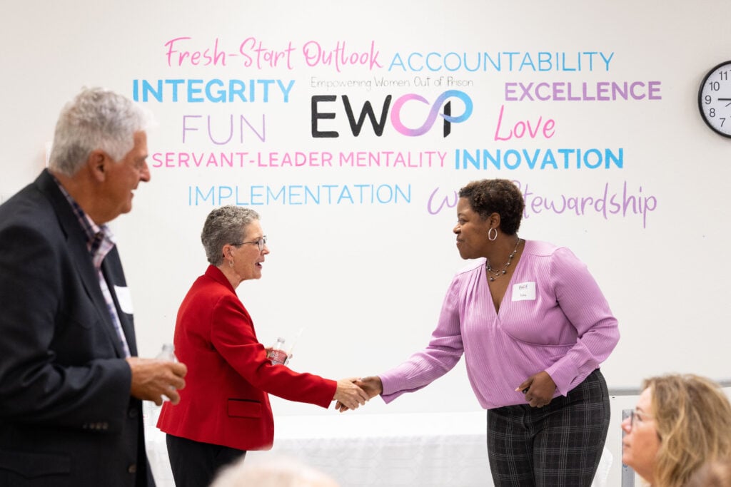 EWOP supporters meeting in front of the organization values wall
