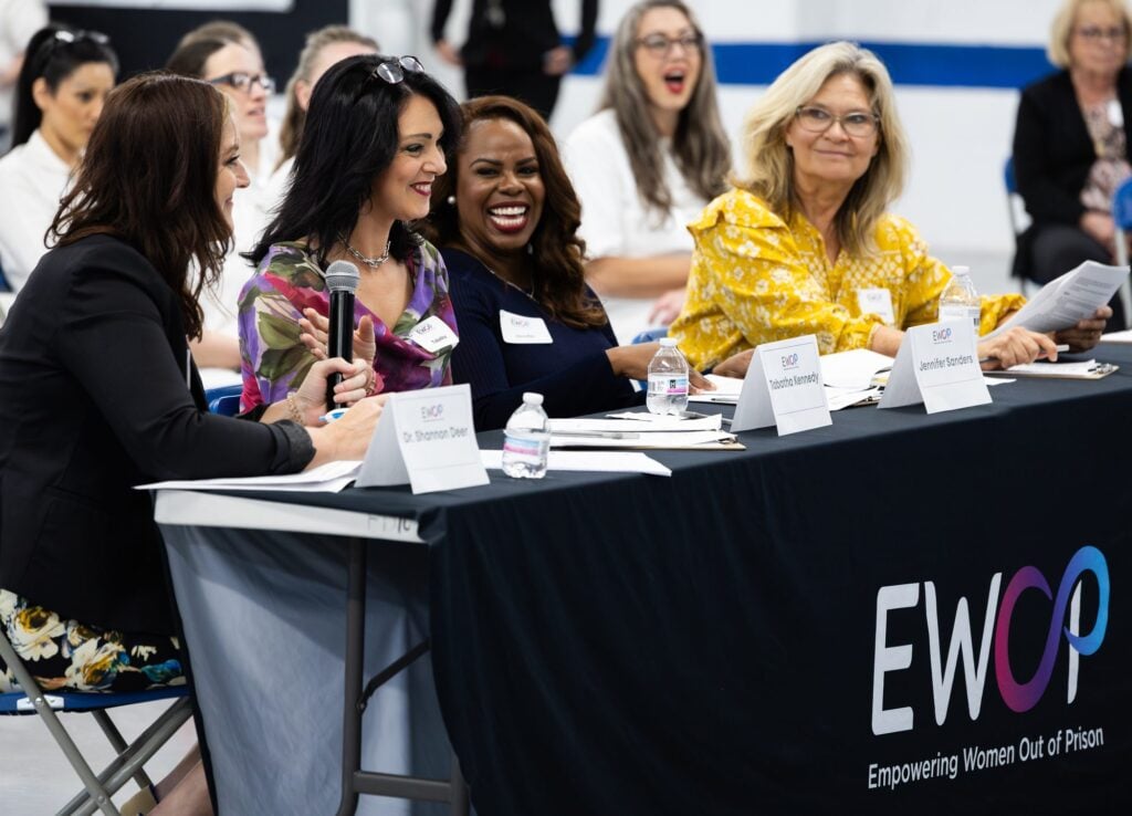 EWOP panelists speaking with attendees at a program event