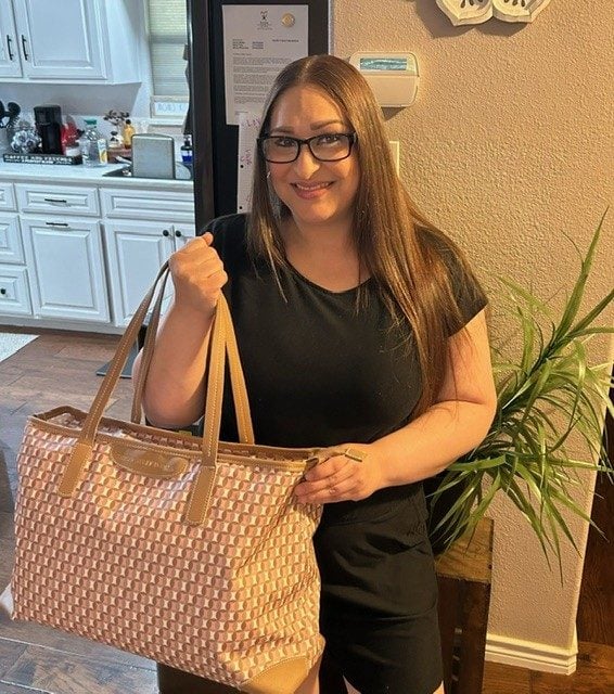 An EWOP graduate with the handbag business she launched after reentry